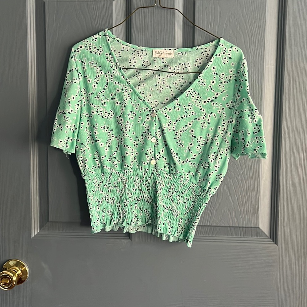 a cute summer top, size medium, by the brand “full circle trends”
